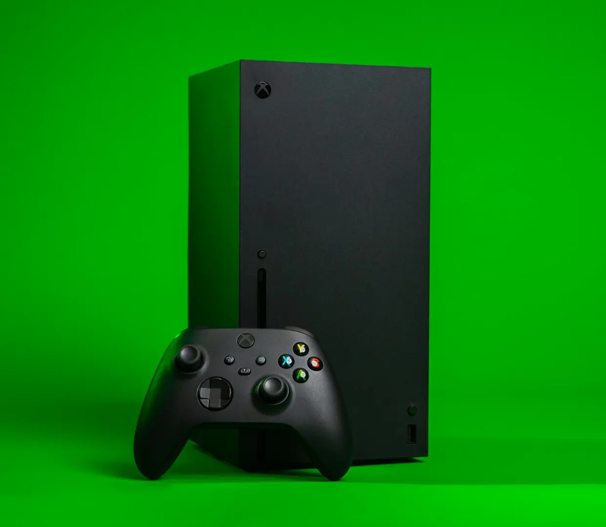 black xbox one console with controller